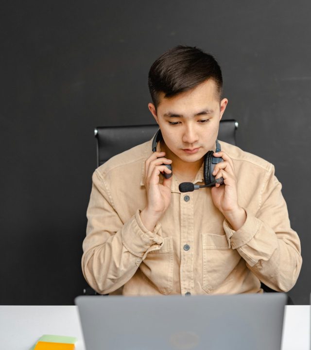 Full-time remote specialist at a laptop desk representing an offshore staffing Philippines dedicated integration tier