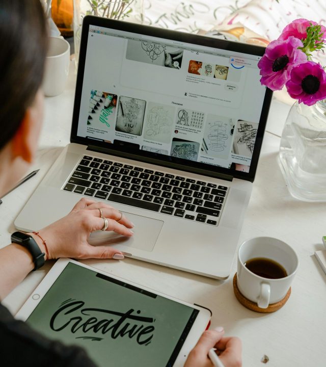 Creative virtual assistant working on a laptop layout for an offshore staffing Philippines agile support plan